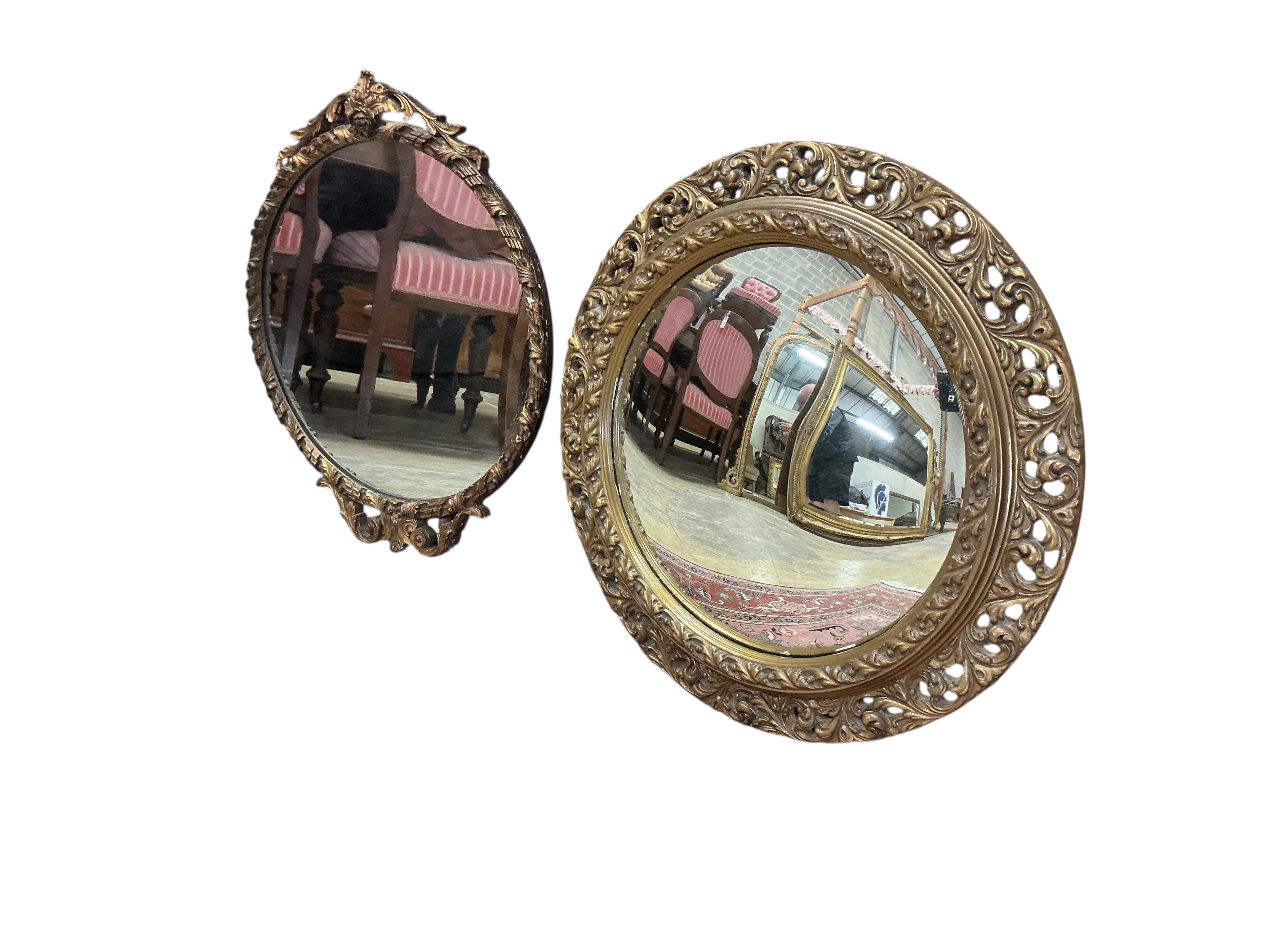 An early 20th century giltwood convex wall mirror, diameter 56cm together with one other circular wall mirror